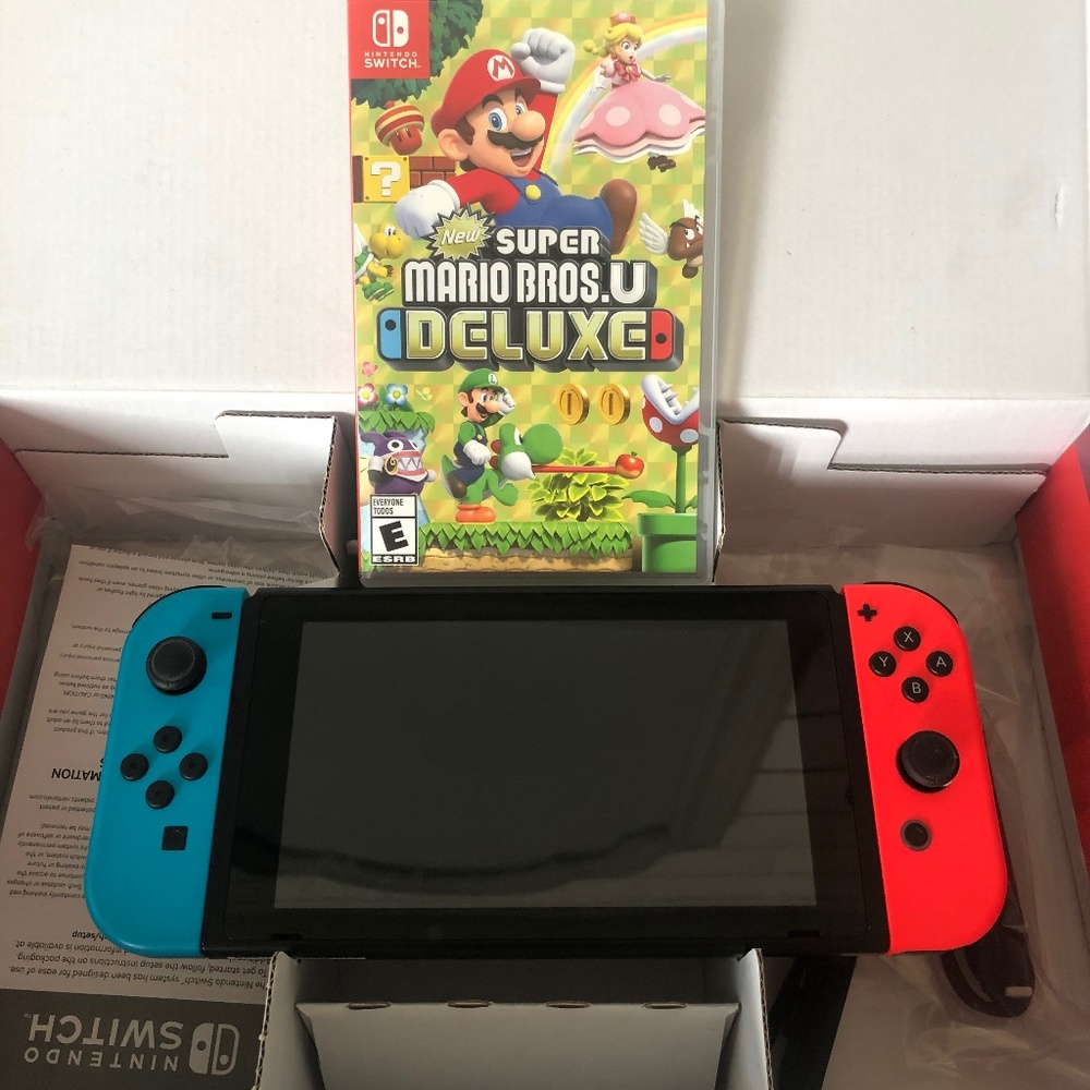 Like New Nitendo Switch with Super Mario Game